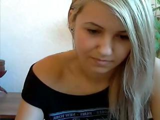 Cute little golden-haired has a smoke and poses fingering pussy on webcam