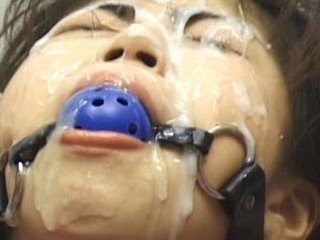 Asians fastened up with ball gags getting bukkake cumshots to their faces.