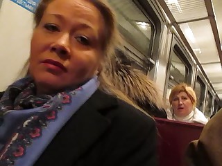 girl flashing fishnet stockings in a train