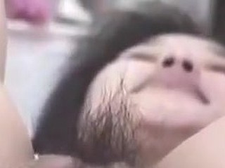 Korean slut with large pussy and pouty lips gets naughty on camera. She stuffs her hairy pussy with fingers, metal balls and even a bottle. This snatch can drink a lot of jizz too!
